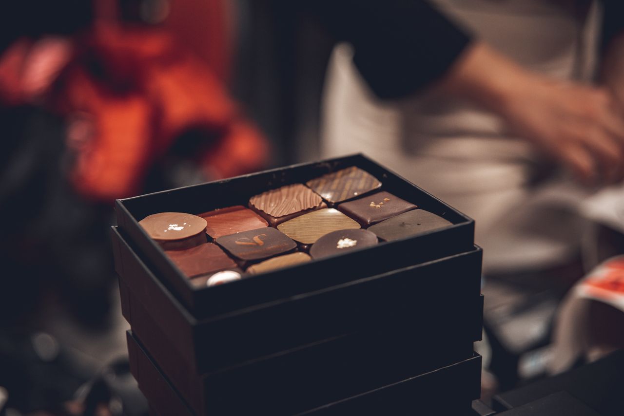 Elegant box of assorted chocolates in a soft focus setting, perfect for gourmet and special gifts.